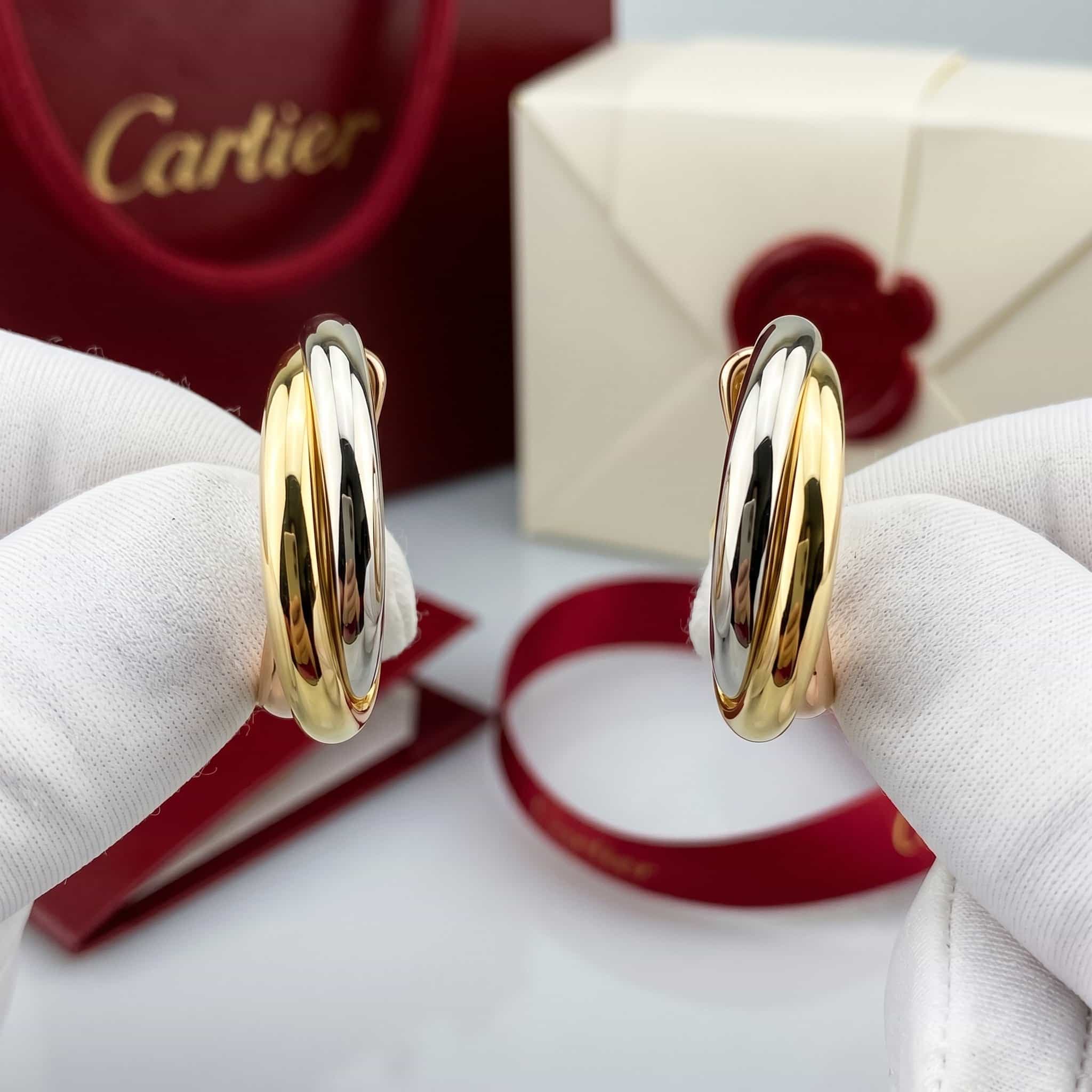 Золотые серьги Cartier Trinity