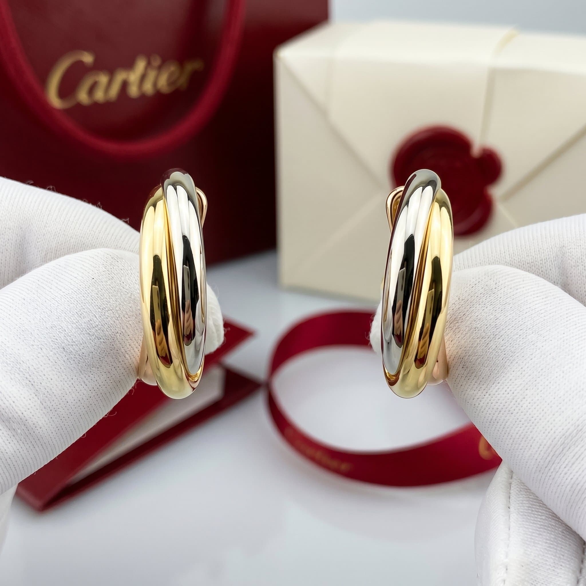 Золотые серьги Cartier Trinity, Белое и жёлтое золото