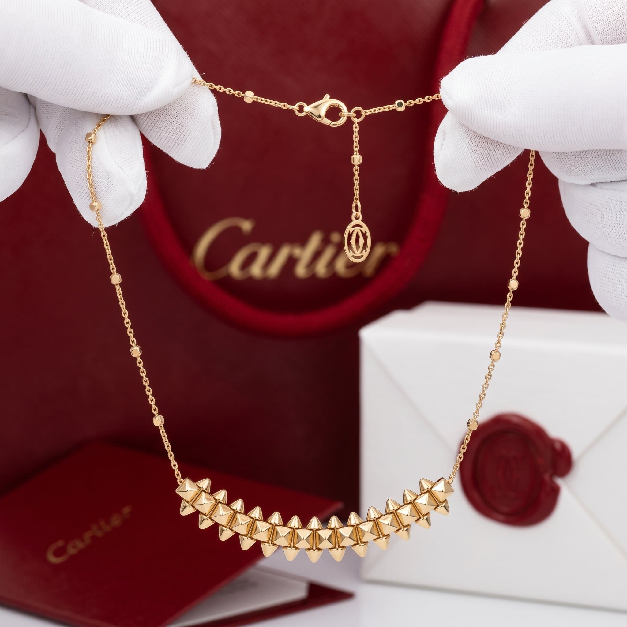 Золотое колье Cartier Clash